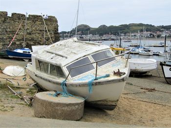 Boats moored at harbor