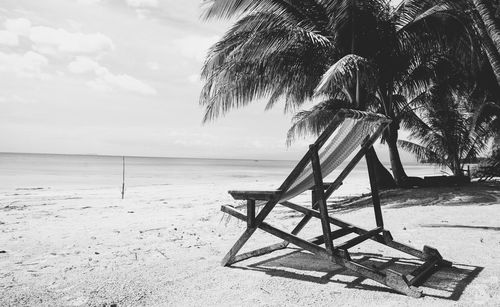 Empty deck chair on beach