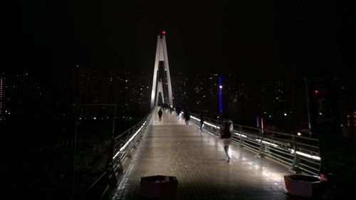 View of illuminated bridge at night