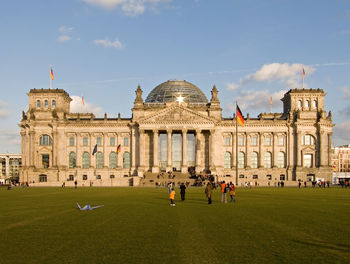 People in front of historical building