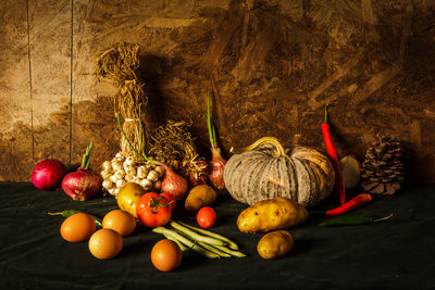 Fruits and vegetables in basket on table