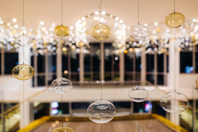Illuminated pendant lights hanging from ceiling