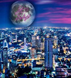 High angle view of illuminated buildings in city at night