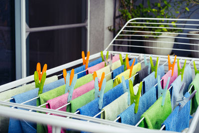 Close-up of multi colored microfiber towel on clothespin