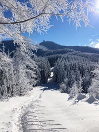Scenic view of snow covered mountains against sky