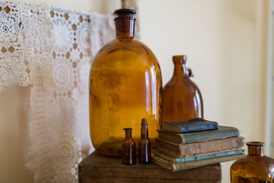 Close-up of vintage wine bottles on table