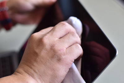 Close-up of hand holding hands