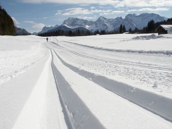 Scenic view of snow mountains against sky