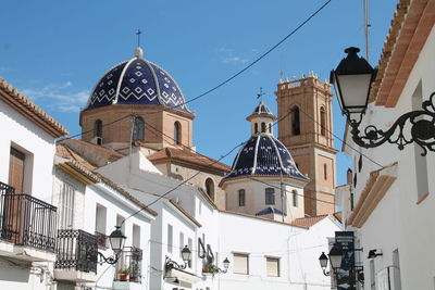 Low angle view of buildings in city against sky