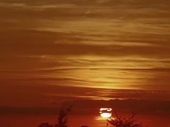 Scenic view of sea against orange sky