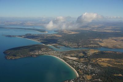 Aerial view of landscape and sea against sky