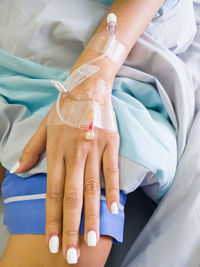 Midsection of woman with iv drip