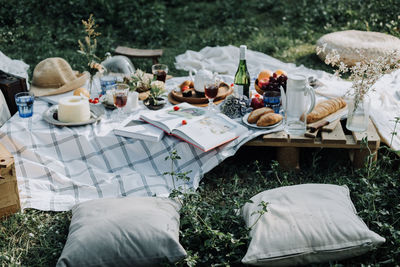 High angle view of food and drink with decorations on table in yard