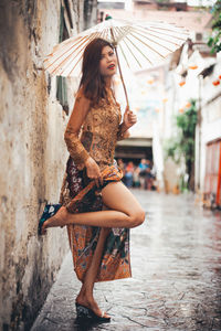 Beautiful young woman in rain