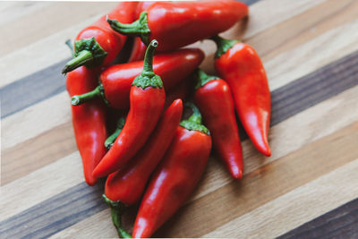 Close-up of red chili peppers on table