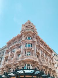 Low angle view of building against blue sky