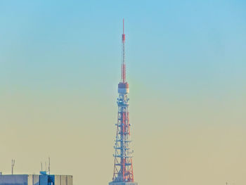 High section of tokyo tower against blue sky