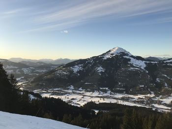 Scenic view of snowcapped mountains against sky