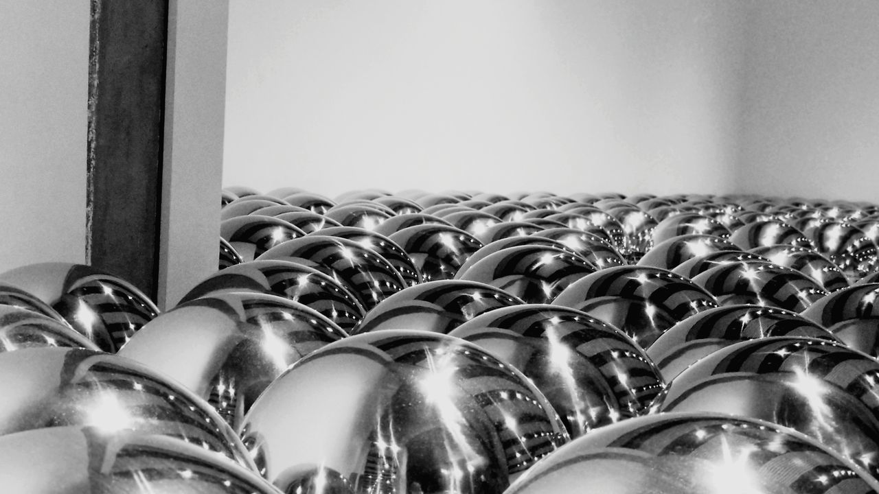 CLOSE-UP OF WINE GLASSES ON GLASS AT HOME