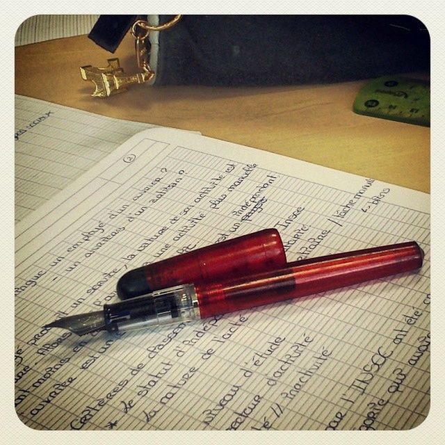 transfer print, table, high angle view, still life, auto post production filter, indoors, close-up, wood - material, pen, book, technology, no people, pencil, music, education, retro styled, wood, selective focus, paper, equipment