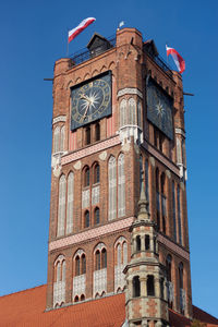 Low angle view of clock tower against sky
