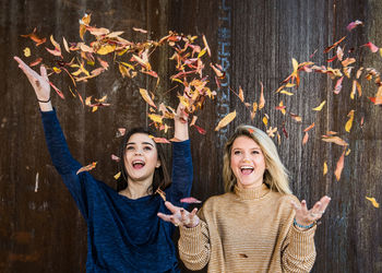Portrait of happy young woman in autumn at night