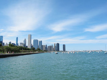 Cityscape against cloudy sky