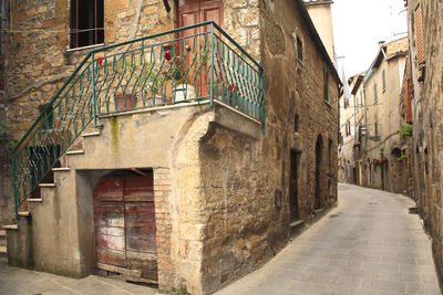 Narrow alley amidst old buildings in town