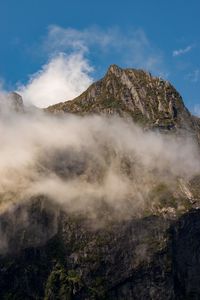 Low angle view of mountain range against sky
