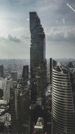 Modern buildings in city against sky