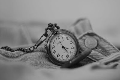 Close-up of clock on table