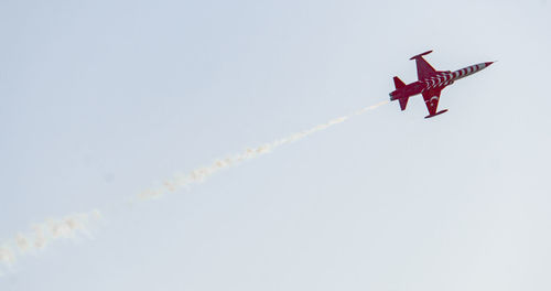 Low angle view of airplane against the sky