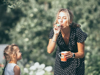 Beautiful young woman drinking water