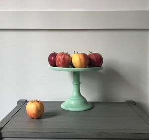 Close-up of apple on table at home