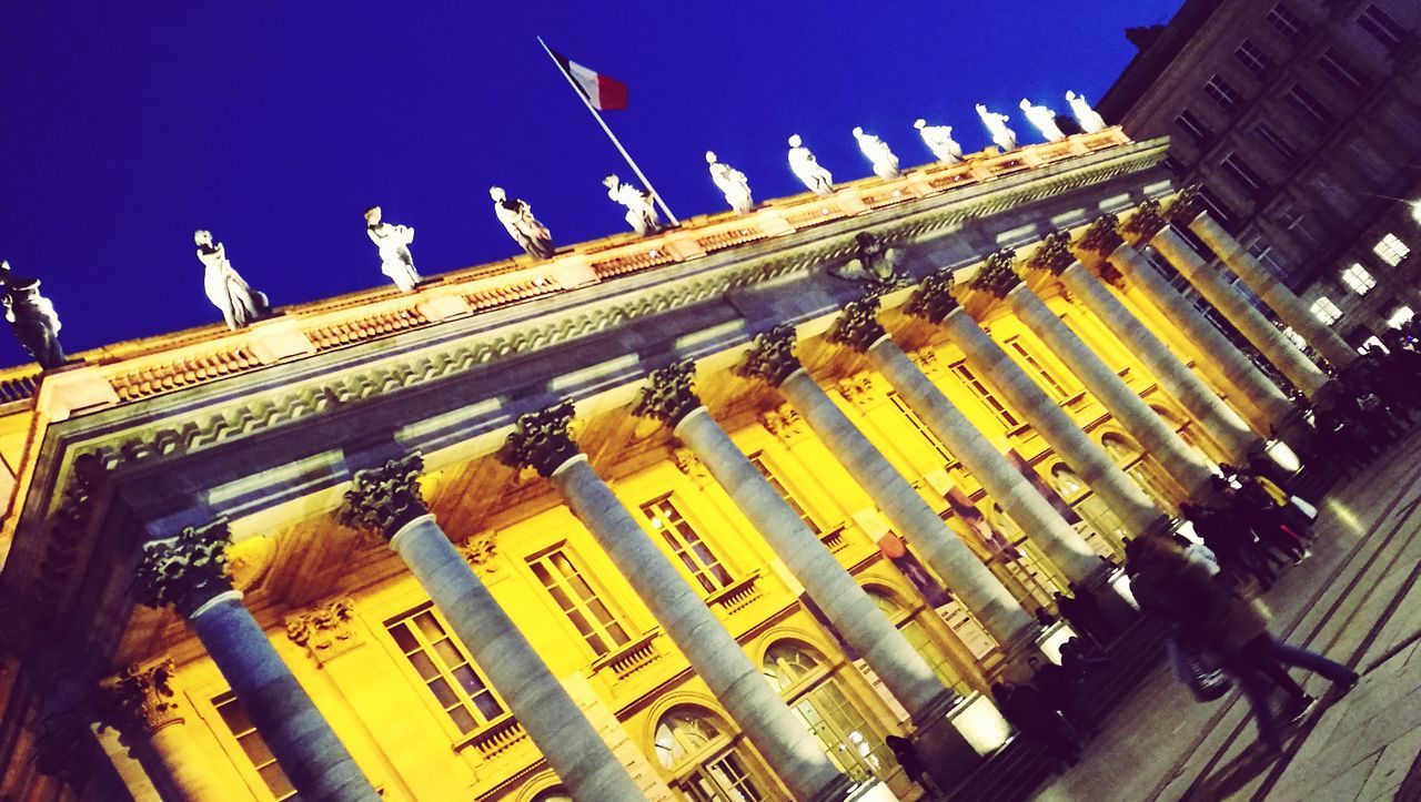 LOW ANGLE VIEW OF ILLUMINATED BUILDING