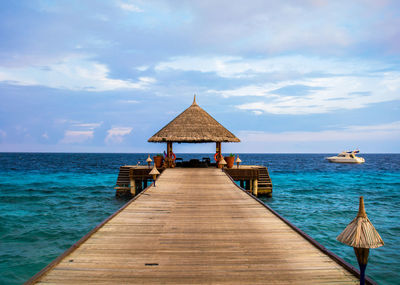 Pier over sea against sky