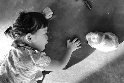 High angle view of boy and cat