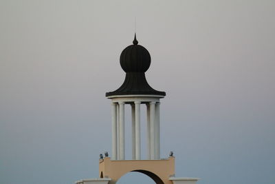 Low angle view of bell tower against sky