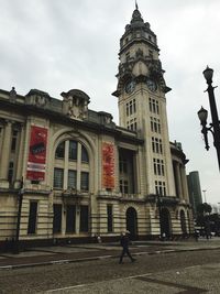 Low angle view of clock tower against sky