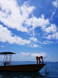 Man on beach against sky