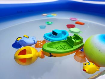 High angle view of toys floating on swimming pool