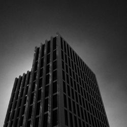 Low angle view of office building against sky