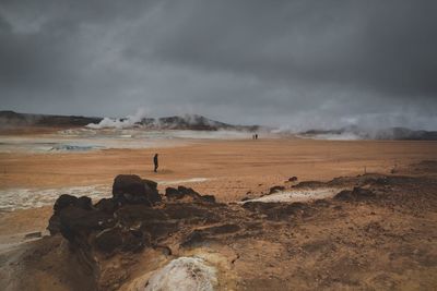 Scenic view of landscape against cloudy sky