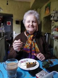 Portrait of woman holding ice cream