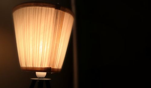 Close-up of illuminated lamp in room