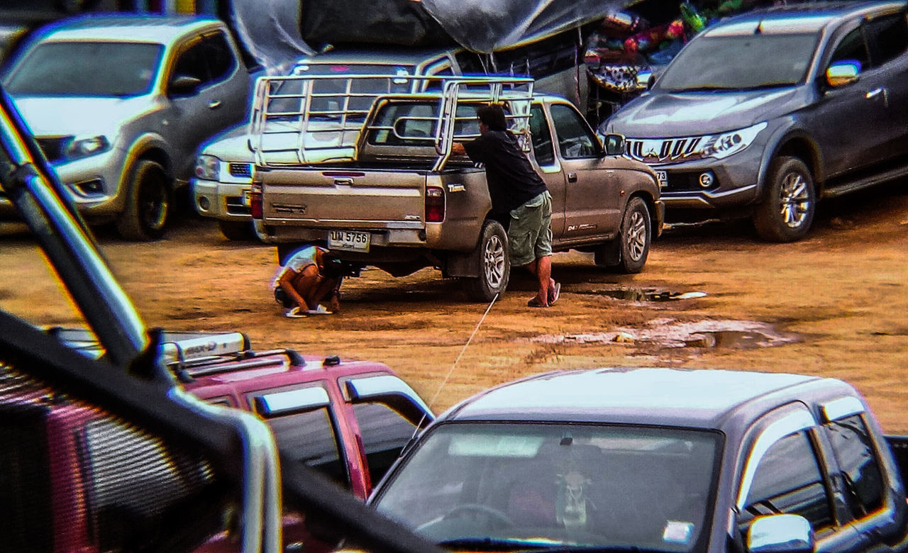 car, mode of transportation, motor vehicle, transportation, land vehicle, real people, day, people, men, travel, street, lifestyles, city, road, retro styled, outdoors, windshield, reflection, stationary