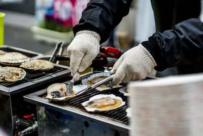 Midsection of man preparing food