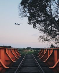 Railroad tracks against clear sky