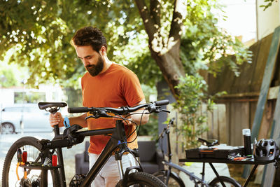 Side view of man riding bicycle