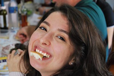 Close-up portrait of smiling young woman